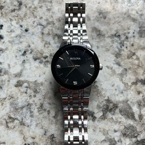 Bulova watch. Women’s. Silver. Black face.